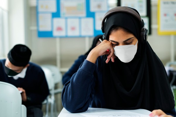 muslimstudentwearingmaskstudyingclassroom.jpg